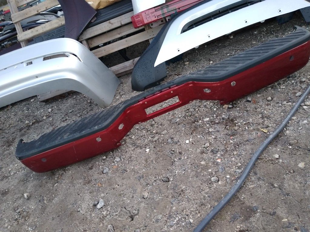 Nissan Titan rear bumper skin and top plastic. 2004 to 2014 all the same
