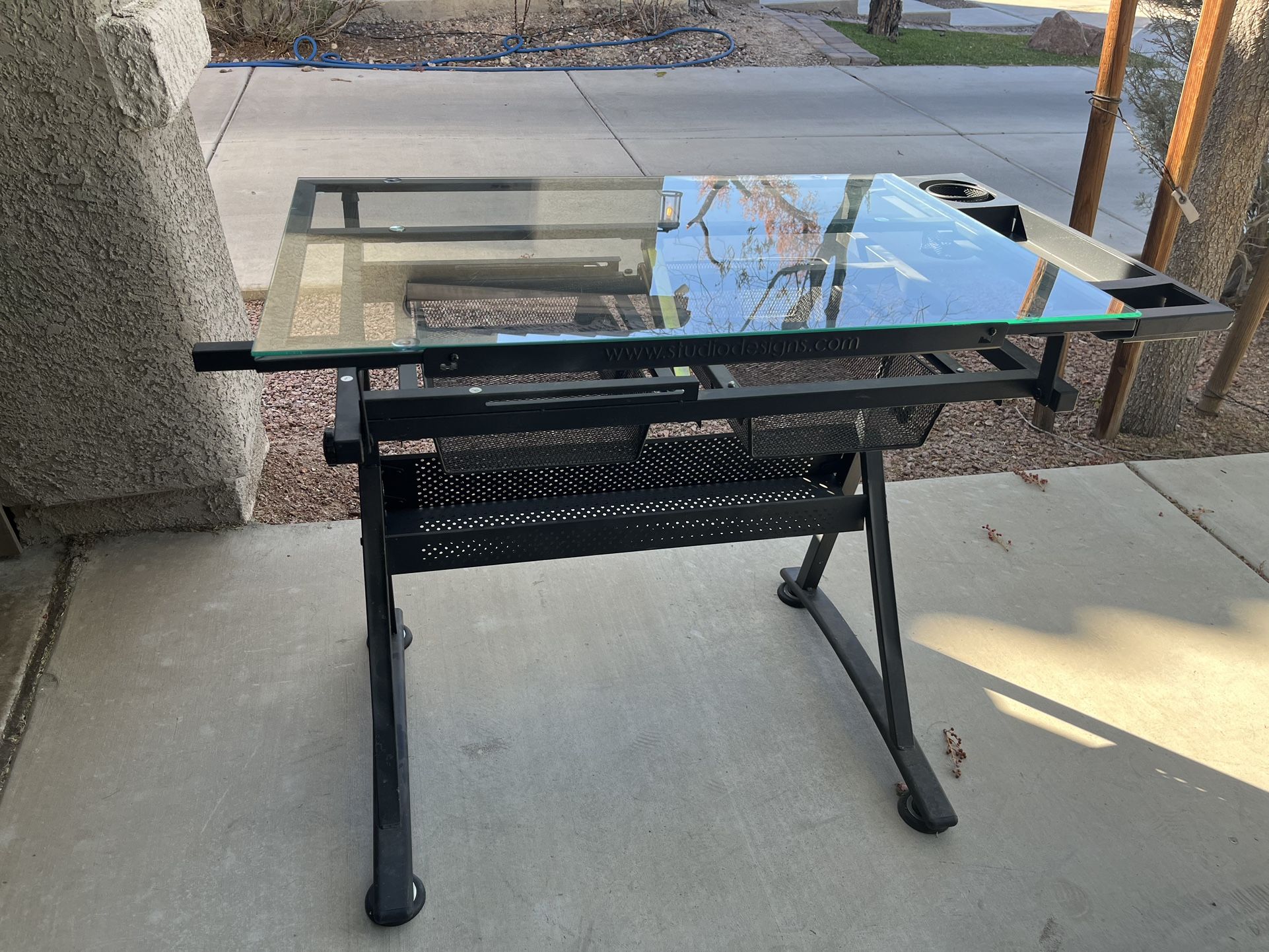 Glass drafting/adjustable Desk.
