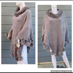 New Women’s pull over Faux Fur poncho size One size Fits up to xl Fur balls attached  Round neck sweater  Very cozy and soft  New with tags Very spaci