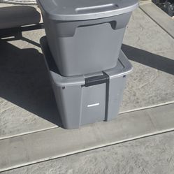 2 grey storage bins