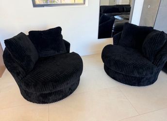 Black upholdered Gramwell swivel chairs