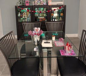 Glass and metal dining table with chairs