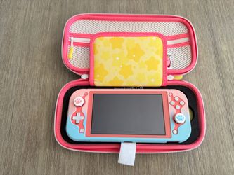 Nintendo Switch Lite Coral Pink with Kirby case
