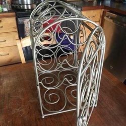 Wine rack with door.Holds six bottles of wine. Measurements are in the pictures. Everett Melvin Ave