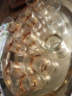 Shot glasses gold banded set of 9 w gold rim plus larger one