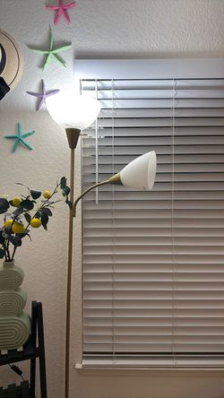 white floor lamp with golden detailing