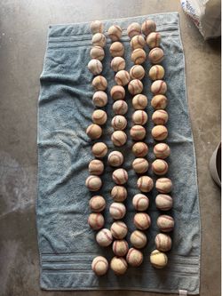 60 used baseballs (hard balls)