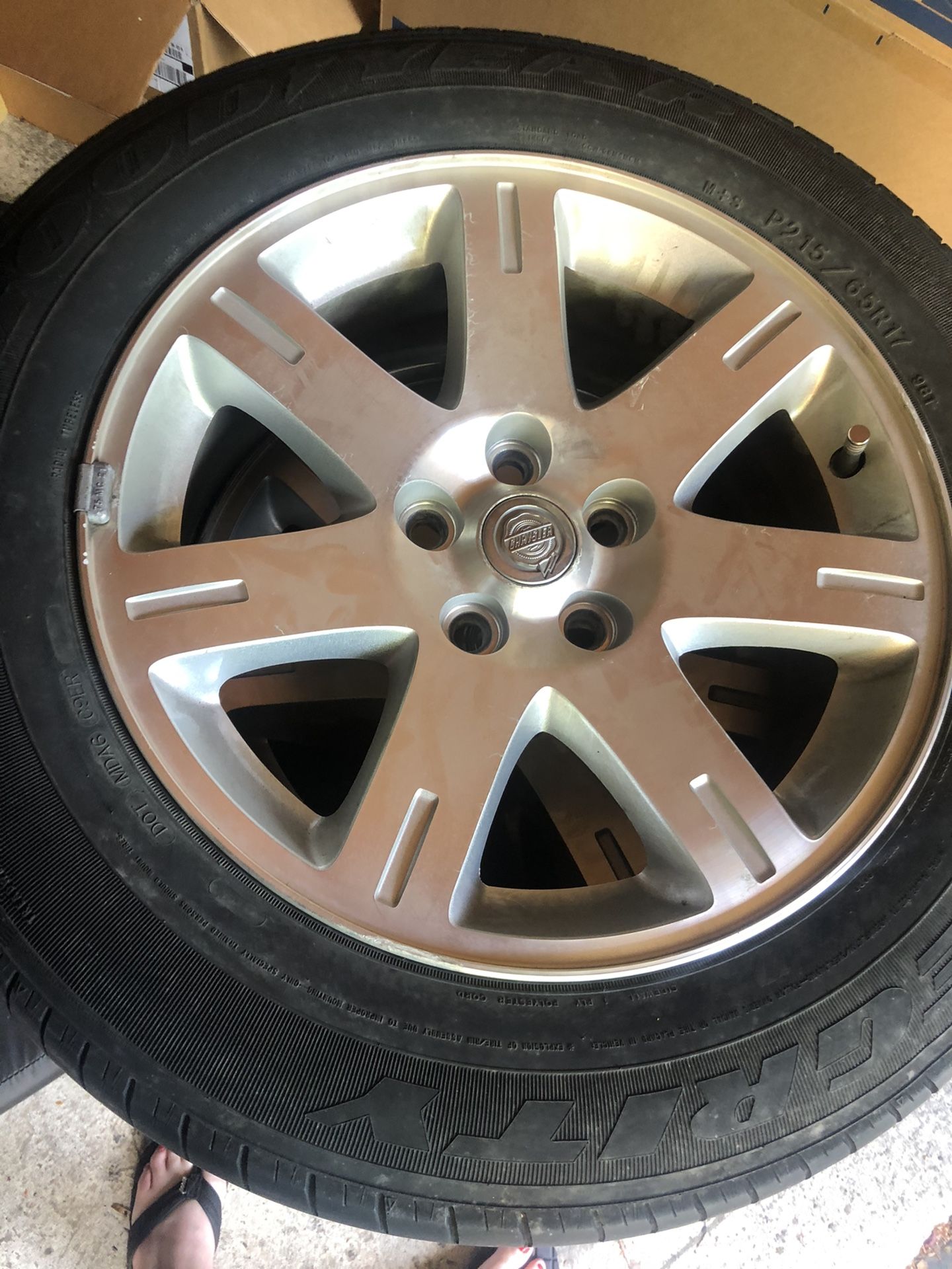 Set of four used Goodyear tires with stock Chrysler 300 alloy rims 17”