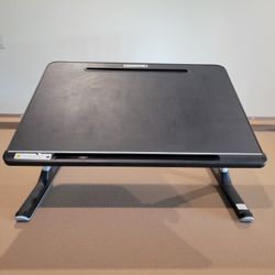 Adjustable laptop bed tray table.