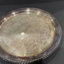 Pair of silver plated trays. Wm. Rogers round 12” tray and 20” Rogers & Bro. platter with handles.  