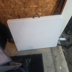 Two White Foldable Tables