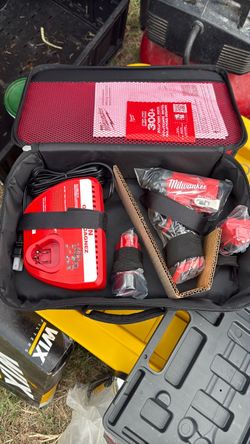 Milwaukee M12 fuel 1/4” hex impact driver with charger and two batteries