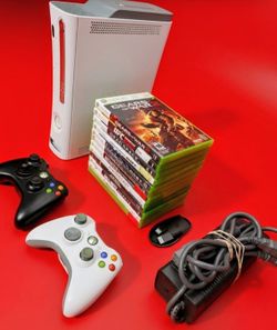 Microsoft Xbox 360 with 2 controllers 12 games HDMI cord power supply