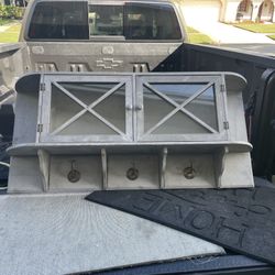 Hanging coat rack with storage