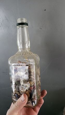 Bottle with rock display, fill with liquid