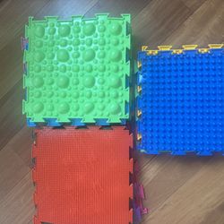 Modular massage mat designed to help form correct footprints and support proper foot development in children.
