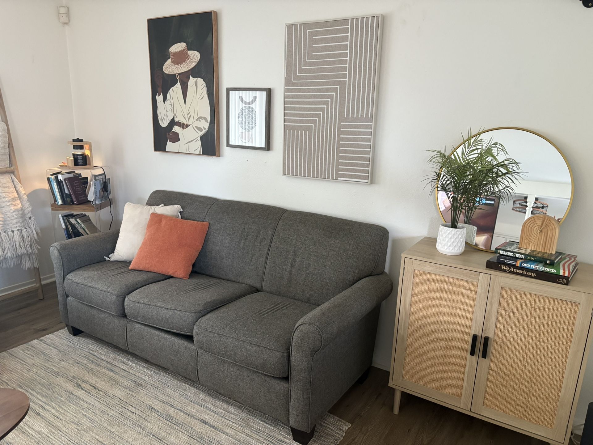 Set of two gray sofas in good condition, and a gift coffee table, bookcase, wall pictures, and storage cabinet.