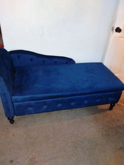 Royal blue couch with storage underneath