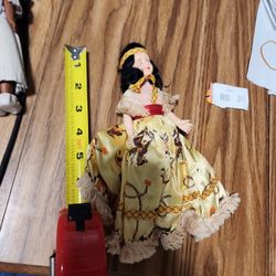 Vintage 7 inch.
Doll With yellow dress and moving eyes.