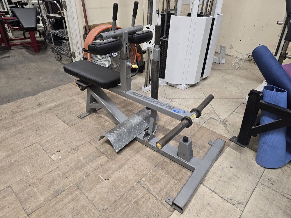 Nautilus xpload seated calf plate loaded commercial gym equipment exercise fitness