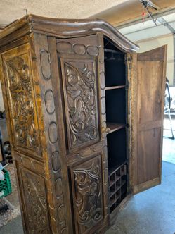 Antique hand carved wine cabinet
