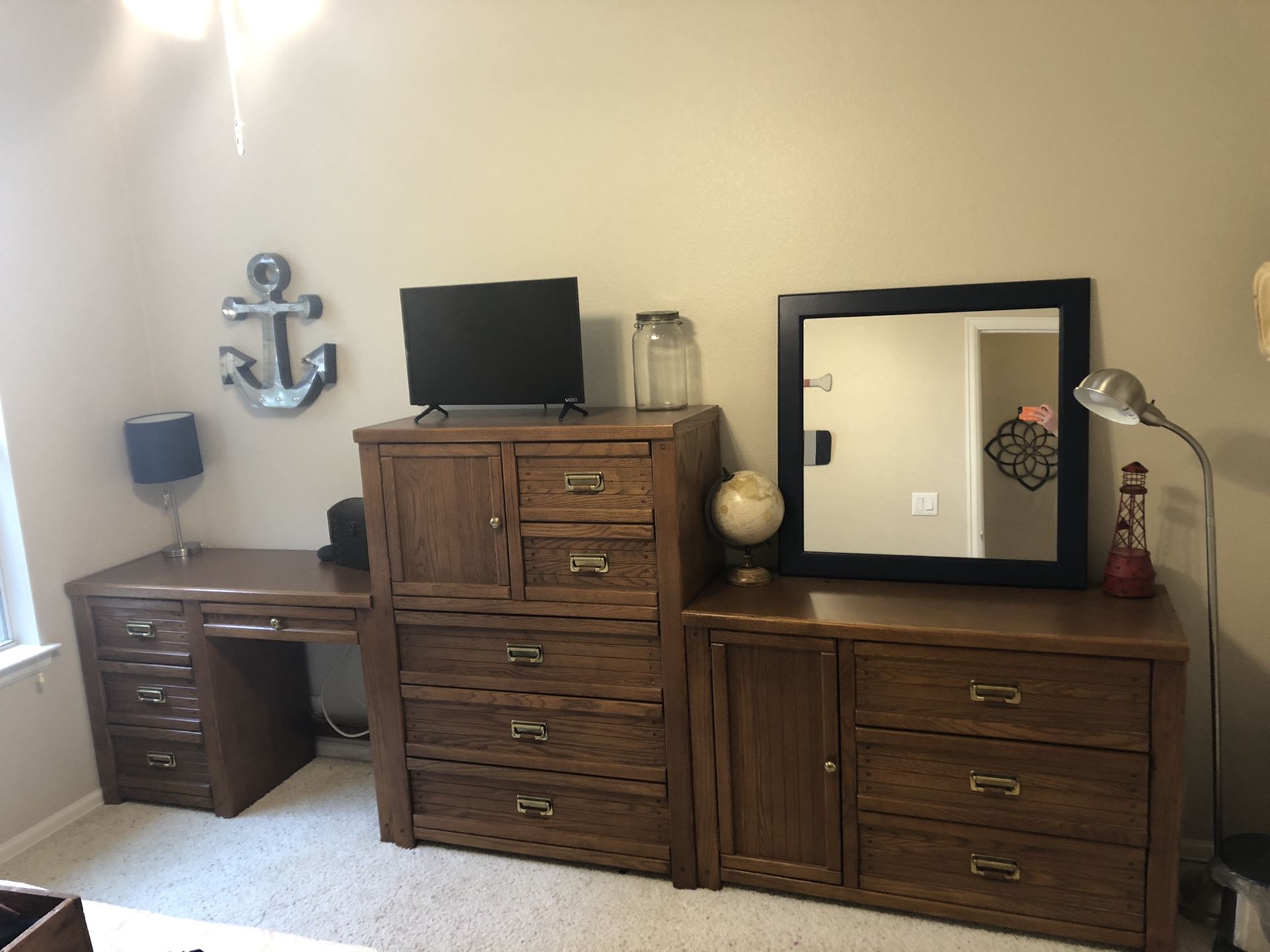Bedroom furniture: desk, tall dresser, dresser.