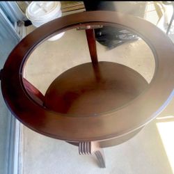 REDUCED $570 Oval mahogany coffee or end table with glass top
