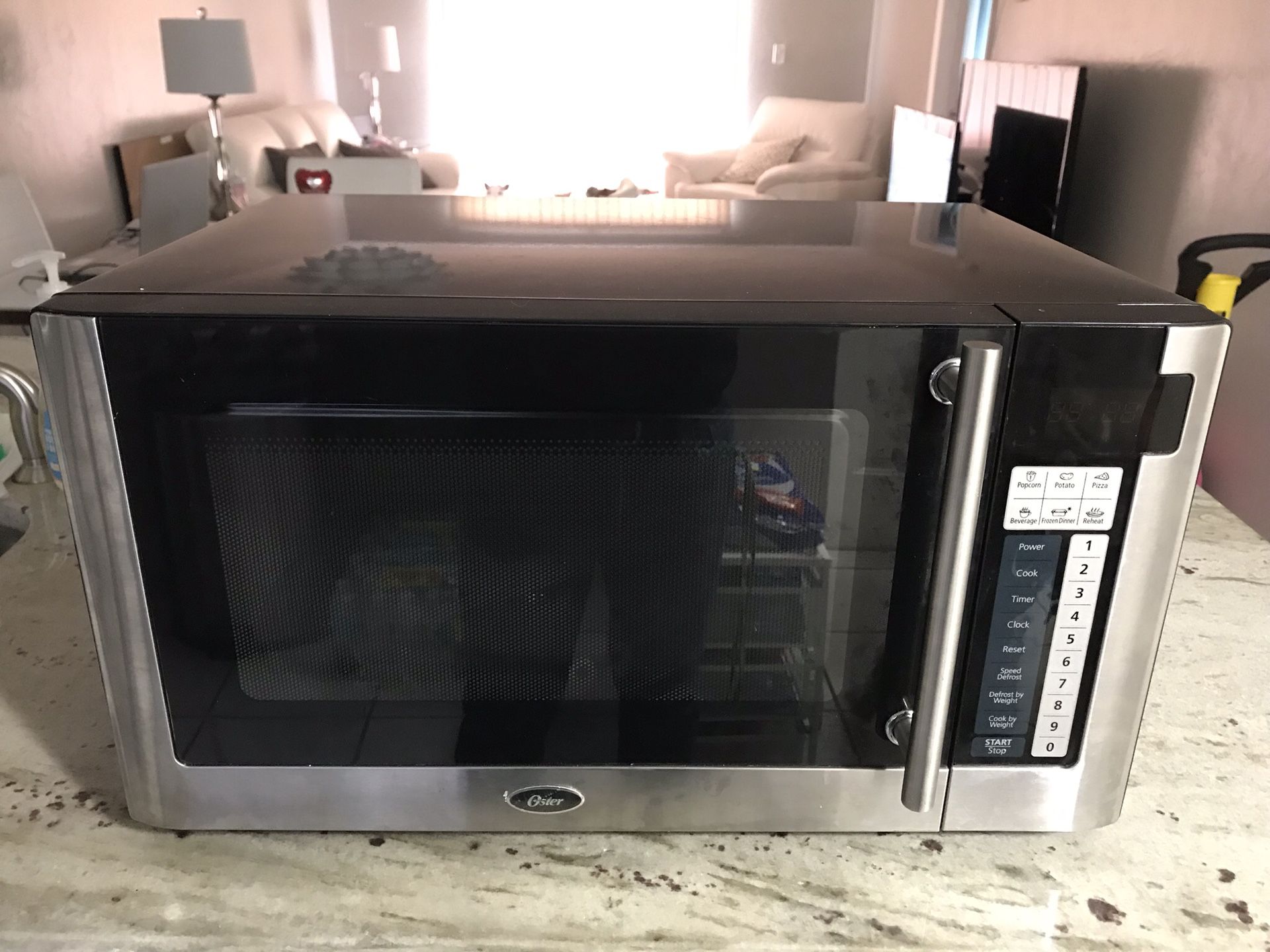 Oster OGG61101 1.1 cu. ft. 1000W Digital Microwave Oven, Stainless Steel &  Black, 1 - Fry's Food Stores