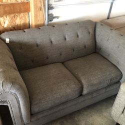 Grey Loveseat “WE DELIVER”