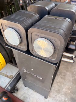 Ironmaster adjustable dumbbells with every option that goes up to 135 pounds each one. Handles a screw are like new plates have some  paint chips  pic