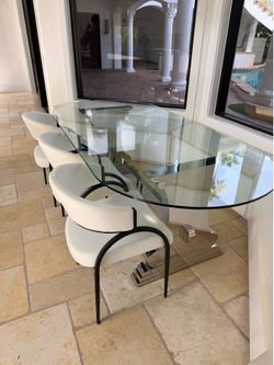 Glass dining table with three chairs
