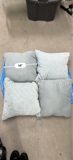 Four medium size decorative pillows