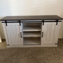 White Tv stand with adjustable shelves.  