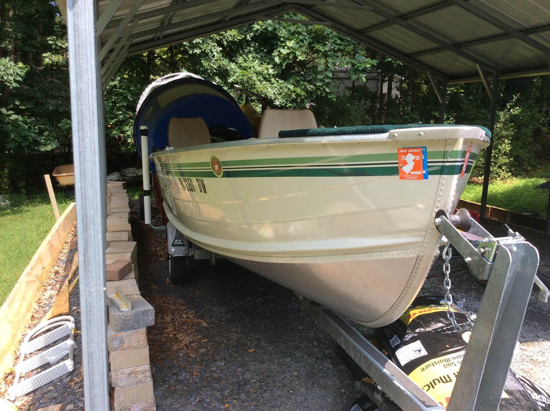 16 foot smoker craft with 9 .9 Mercury engine new trailer live bait