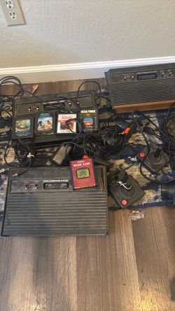 Atari set for sale 3 counsels 4 joy sticks plus over 30 games
