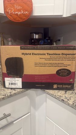 Touchless towel dispenser