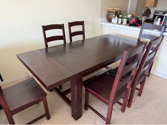 Dark wood table set with 6 chairs