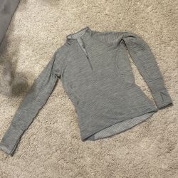 Nike dri fit gray long sleeve top shirt women athletic xsmall like new Wore once like a thin fleece material inside. Zip side pocket