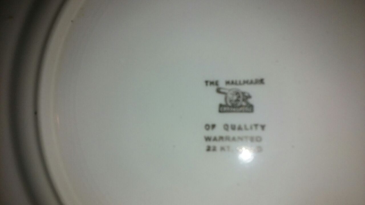 The hallmark of quality warranted 22 kt gold plate set