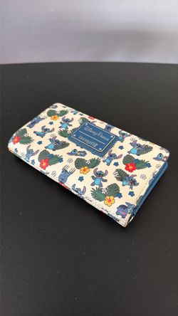 Disney Parks Loungefly Stitch Tropical Floral Wallet featuring an all-over print of Stitch with colorful flowers and leaves