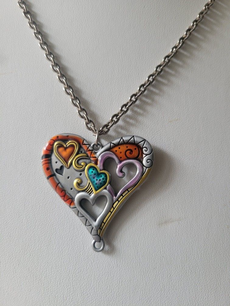 Large heart pendant and chain silver tone.  See all pics for more details 