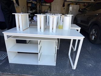 two desks with shelves and drawers