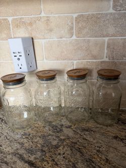 4 - 1 quart mason jars with wooden lids
