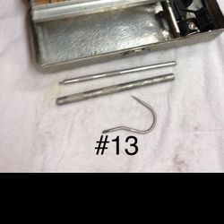 Tackle Box With Some Accessories And Gaff Hook.