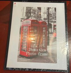 - 11“ x 17“ photo frame matted for 10.5” X 16.5 in overall frame is 21 in tall X 17 in wide