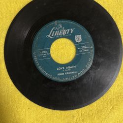 This is a 1958 rockabilly 45 rpm vinyl record on the Liberty label by Eddie Cochran. 