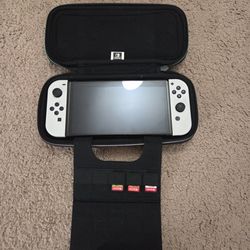 Nintendo Switch OLED with Four (4) Games and Case