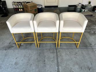 3 White barstools with gold accent