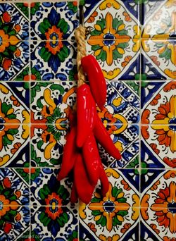 Traditional ceramic chili pepper ristra (hanging decorative string of red chili
