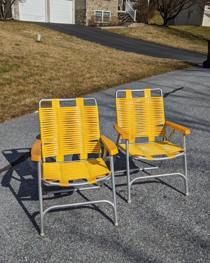 Two Vintage Yellow Aluminum Folding Chairs 